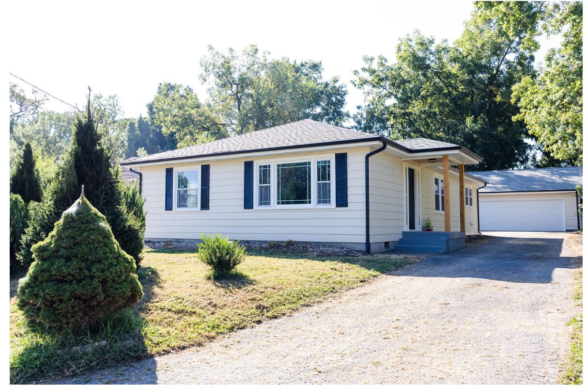 Wide view of The Peach House exterior after renovation