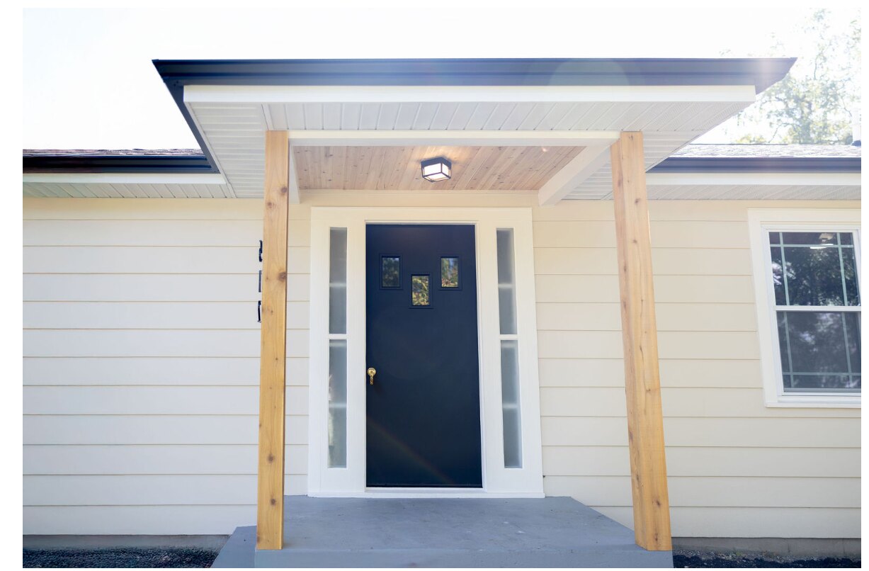 Rebuilt covered front entrance with wood ceiling